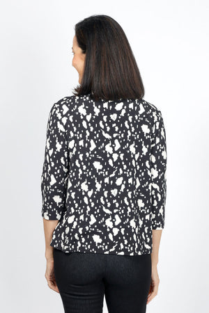 Lolo Luxe Sherri Cow Print Top in Black with white spots. V neck 3/4 sleeve top with high low hem. Relaxed fit._34943413223624