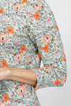 Lolo Luxe Watercolor Floral Top. Orange large floral and miniature vintage floral print on a mint green background. Crew neck 3/4 sleeve top with ruched sleeve hem. Relaxed fit._t_34940530458824