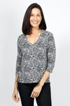Lolo Luxe Sherri Scroll Flames Top.  Abstract black spiral print on a smoke background.  V neck 3/4 sleeve top.  High low hem. Relaxed fit._t_34940537897160