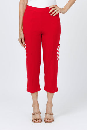 O.U.R.S. Lucy Pant in Red. Pull on crop pant with striped cargo pocket on outer leg. 1 1/2" waistband. Falls straight from hip._34656974504136