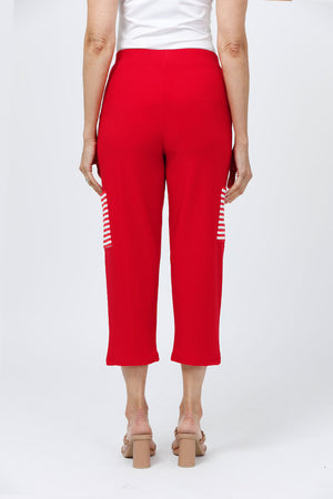 O.U.R.S. Lucy Pant in Red. Pull on crop pant with striped cargo pocket on outer leg. 1 1/2" waistband. Falls straight from hip._34656974438600