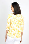 Lolo Luxe Trish Paper Dots Top in Yellow. Abstract gradient dots on a white background. Banded collar split v neck top with 3/4 sleeve with banded cuff. Curved hem. Relaxed fit._t_34940477407432