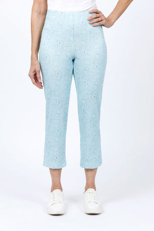 Holland Ave Susan Dotted Flowers Crop in Aqua.  Tonal dotted flower print.  Pull on pant with hidden elastic waist and faux fly placket.  Snug through hip and thigh falls straight to hem.  24" inseam._34811687239880