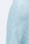 Holland Ave Susan Dotted Flowers Crop in Aqua. Tonal dotted flower print. Pull on pant with hidden elastic waist and faux fly placket. Snug through hip and thigh falls straight to hem. 24" inseam._t_34811687207112