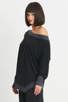 Planet Matte Jersey Boat Neck Top in Black with Obsidian gray trim at neckline, cuff and hem. Boat neck with long sleeves and cinched cuff. Asymmetric pointed hem in front. Slightly curved hem in back. Oversized fit. One size fits many._t_34273174618312
