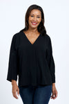 Top Ligne Dolman Roll Tab Top in Black. Gently crinkled fabric. V neck with center front pleat. Dolman 3/4 sleeve with roll button tab cuff. A line shape. Relaxed fit._t_34767644131528