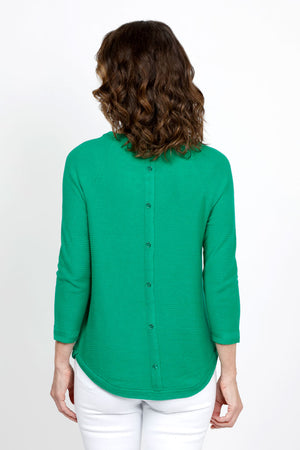 Ten Oh 8 Button Back Sweater in Green. Crew neck 3/4 sleeve horizontal textural rib. Curved hem. Braid trim at neck, hem and cuff. Button detail down center back. Relaxed fit._35432693137608