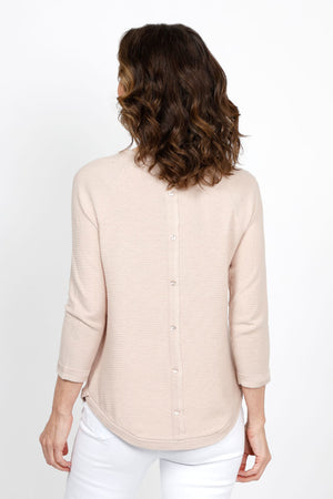 Ten Oh 8 Button Back Sweater in Sand. Crew neck 3/4 sleeve horizontal textural rib. Curved hem. Braid trim at neck, hem and cuff. Button detail down center back. Relaxed fit._35432693170376