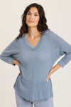 Wearables Mesh Fira Pullover in Orion Blue, a slate blue. V neck mesh pullover with 3/4 sleeve and drop shoulder. Rib trim at neck and cuff with raw edge. Curved hem with raw edge. Relaxed fit._t_35102551802056
