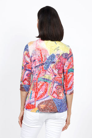 Top Ligne Chroma Art Grommets Top. Brightly colored abstract art print. V neck with banded neckline and 3/4 sleeve. Grommet and lace-up detail on lower left side. Relaxed fit._35333631934664