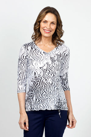 Top Ligne Squiggles Grommets Top in Black & White.  Op art squiggle print in black on a white background.  V neck 3/4 sleeve top with grommets and lace-up detail at left front hem.  Relaxed fit._35010878144712