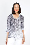 Top Ligne Hexagonal Shredded Back Top in Black I& White.  Gradient printed hexagonal shapes in black and white.  V neck 3/4 sleeve crinkle top with red button detail at sleeve hem.  Inset v at back with shredded strips of fabric.  Relaxed fit._t_35333581340872