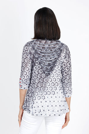 Top Ligne Hexagonal Shredded Back Top in Black I& White. Gradient printed hexagonal shapes in black and white. V neck 3/4 sleeve crinkle top with red button detail at sleeve hem. Inset v at back with shredded strips of fabric. Relaxed fit._35333581308104