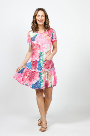 Top Ligne Starry Scene Dress in Multi. Large abstract floral print in shades of pink blue and green.  Crew neck short sleeve dress with inset flounce at bottom 3rd. Ruffle trim at neck and hem. Raw edges. Relaxed fit._35007917064392