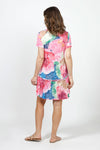 Top Ligne Starry Scene Dress in Multi. Large abstract floral print in shades of pink blue and green. Crew neck short sleeve dress with inset flounce at bottom 3rd. Ruffle trim at neck and hem. Raw edges. Relaxed fit._t_35007917129928