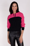 Planet Waffle Hoodie in Lipstick/Black. Two tone waffle pullover hoodie. Crew neck with attached hood and knit drawstring. Long sleeves with contrast color cuffs. Rib trim at cuff and hem. Cropped length. Oversized at shoulder and bust; cinched at hem.One size fits many._t_34329581781192
