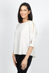 Sympli Convoy Top in Cashew. Boat neck relaxed top with elbow length slit sleeve. Functional buttons on sleeve. Slightly tapered to hem._t_35033450938568
