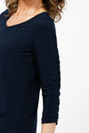 Sympli Revelry Ruched Sleeve Top in Navy. V neck 3/4 sleeve with ruched detail down center sleeve. Side slits. A line shape. Relaxed fit._t_35242310959304