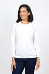 Metric Pointelle Crew Neck Sweater in White. Crew neck long sleeve sweater with raglan sleeves. Pointelle stitching at seams. Rib trim at neck, hem and cuff. Classic fit._t_35103948931272
