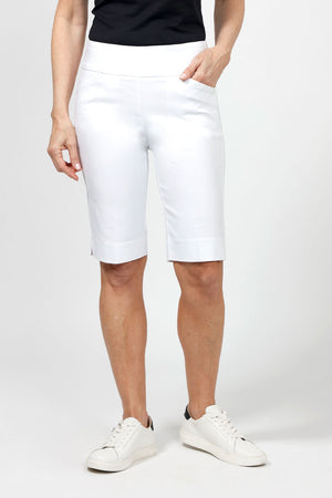 Holland Ave Bermuda Short in White. 2 1/2" waistband with 2 front slash pockets. 11" inseam. Snug through stomach and hip, slim to hem._34995042123976
