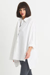 Planet EZ Shirt in White. Pointed collar button down blouse with covered button placket. Swing shape. High low hem with side slits. Long sleeves with roll cuffs. Oversized fit. One size fits many._t_34276446798024