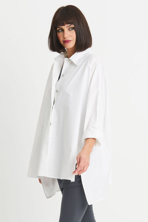 Planet EZ Shirt in White. Pointed collar button down blouse with covered button placket. Swing shape. High low hem with side slits. Long sleeves with roll cuffs. Oversized fit. One size fits many._34276446798024