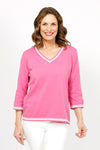 Metric Stripe Border Sweater in Rose. White double stripe at neck, cuff and hem. V neck, 3/4 sleeve sweater. Open weave knit down center of arm. Relaxed fit._t_35066090619080