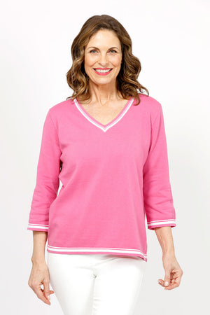 Metric Stripe Border Sweater in Rose. White double stripe at neck, cuff and hem. V neck, 3/4 sleeve sweater. Open weave knit down center of arm. Relaxed fit._35066090619080