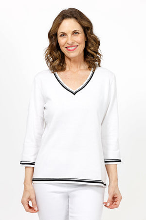 Metric Stripe Border Sweater in White. Black double stripe at neck, cuff and hem. V neck, 3/4 sleeve sweater. Open weave knit down center of arm. Relaxed fit._35066090324168
