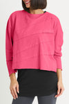 Planet Mini Tucked T in Lipstick Pink, a deep magenta.. Crew neck cropped oversized tee with diagonal tuck pleats on front and back. Long sleeves. Oversized fit._t_34277785567432