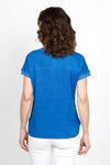 Elliott Lauren Metallic Linen Top in Blue. Linen knit garment dyed. V neck with dolman cap sleeve. Silver metallic ribbed trim at neck and cuff. Curved hem. Side slits. Relaxed fit._t_35419557953736