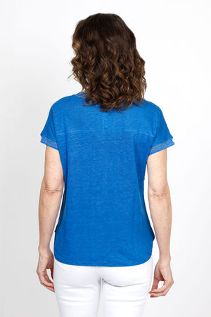 Elliott Lauren Metallic Linen Top in Blue. Linen knit garment dyed. V neck with dolman cap sleeve. Silver metallic ribbed trim at neck and cuff. Curved hem. Side slits. Relaxed fit._35419557953736
