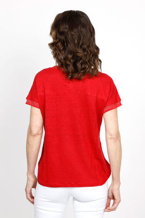 Elliott Lauren Metallic Linen Top in Vermillion Red. Linen knit garment dyed. V neck with dolman cap sleeve. Silver metallic ribbed trim at neck and cuff. Curved hem. Side slits. Relaxed fit._35419557920968