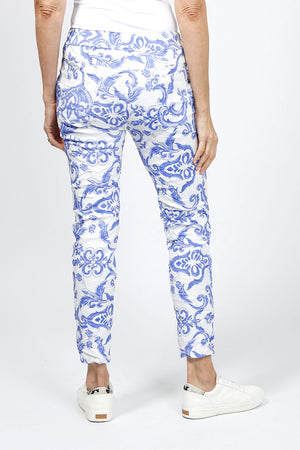 Organic Rags Damask Print Pant in Royal. Scroll print on a white background. Elastic waist pull on pant with 2 slash pockets. No wrinkle pre crinkled fabric. Slim through leg. Convertible hem. 27" inseam._34960586408136