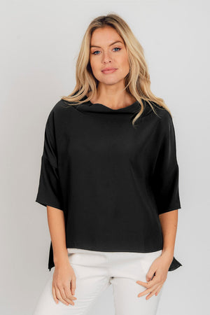 Suzy D Audrey Cowl Neck Top in Black. Draped cowl neck with dropped shoulder and elbow length sleeve. Side slits. High low hem. Relaxed fit._34574866710728