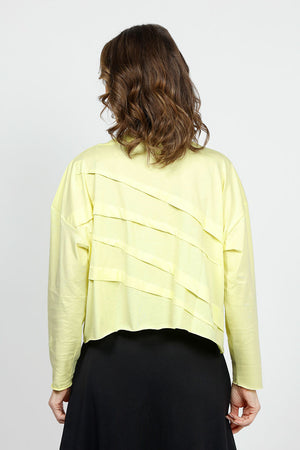 Planet Mini Tucked T in Citron. Crew neck cropped oversized tee with diagonal tuck pleats on front and back. Long sleeves. Oversized fit._34924074598600