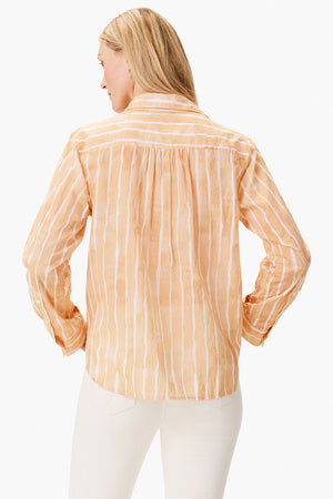NIC+ZOE Watercolor Stripe Girlfriend Blouse in Orange Multi. Watercolor vertical stripes in white. Relaxed fit button down with long sleeves and 1 button cuffs. Pointed collar. Back yoke. Shirt tail hem._35084206506184