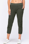 Wearables Geyser Crop Pant in Olive. Pull on pant with ruched jersey insets. 10" rise. 24 1/2" inseam. 2 front pockets_t_33926743654600