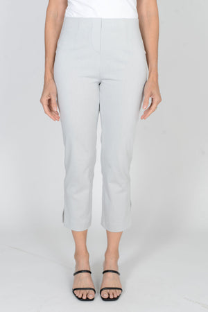 Holland Ave Susan Denim Crop Pant in Pearl gray. Pull on hidden waistband pant with faux zipper flap. Snug through hip falls straight to hem. Side slits. 25" inseam._34070715433160