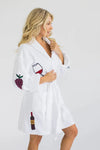 Unwind with the luxurious On Cloud Wine Terry Robe! Made from 100% cotton, this plush bathrobe is decorated in whimsical vino inspired illustrations and features two front patch pockets, a turned back shawl collar, and an adjustable self wrap belt for maximum comfort. _t_33553063870664