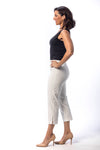 Holland Ave Susan Denim Crop Pant in White. Pull on hidden waistband pant with faux zipper flap. Snug through hip falls straight to hem. Side slits. 25" inseam._t_13297494982765