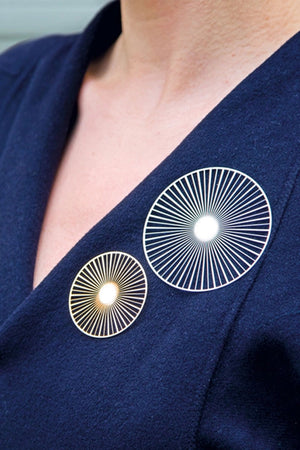 Two solar pins on blue collar_32542922703048