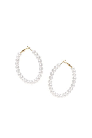 The Pearly Hoop Earrings are classic and chic hoop earrings each featuring 23 luminous imitation pearl beads on a golden wire hoop secured by a standard hypoallergenic earring post and hinged clasp._33085569794248