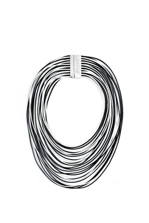 The Tight Rope Necklace is a multi-strand layered collar necklace made of lightweight, faux leather cords and secured by a hypoallergenic nickel snap magnet clasp._32558741913800