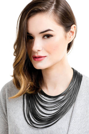 Multi-strand layered collar necklace made of lightweight, faux leather cords secured by a hypoallergenic nickel magnetic snap clasp._32558740897992
