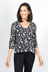 Lolo Luxe Sherri Cow Print Top in Black with white spots. V neck 3/4 sleeve top with high low hem.  Relaxed fit._t_34943413059784