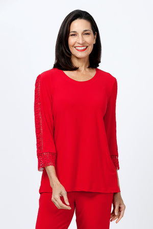 Ours Barbie Crochet Sleeve Top in Red. Banded crew neck with 3/4 sleeve. Crochet lace inset down center of sleeve. Crochet lace cuff. A line shape. Relaxed fit._34656862077128