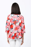 Cali Girls Giant Flowers Swing Blouse in Multi. Bright pink, red and white flowers on a navy background. Spread collar pull over blouse with deep v neck. 3/4 sleeve with turnback cuff. Back inverted pleat. Single front patch pocket. High low hem. Relaxed fit._t_34826833428680