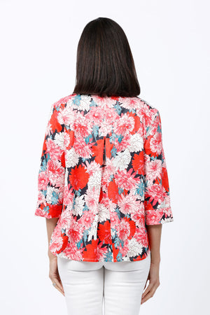 Cali Girls Giant Flowers Swing Blouse in Multi. Bright pink, red and white flowers on a navy background. Spread collar pull over blouse with deep v neck. 3/4 sleeve with turnback cuff. Back inverted pleat. Single front patch pocket. High low hem. Relaxed fit._34826833428680