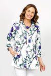 Beau Chemise Bobbi Abstract Floral Blouse. Blue, purple and green abstract floral print on a white background. Adjustable wire collar with 3/4 sleeve with elastic cuffs. Sateen fabric . Relaxed fit._t_35072117899464